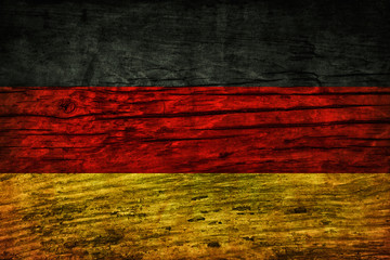 Vintage flag of Germany on a wooden surface