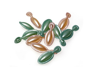 Cosmetic capsules isolated on white