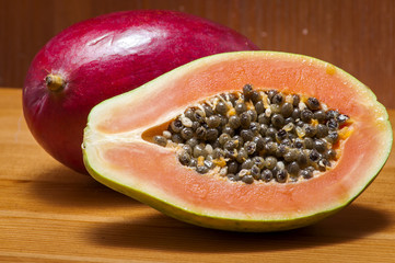 Sliced papaya, also popular as pawpaw, is packed with numerous health benefiting nutrients.