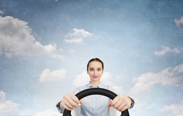 Woman with steering wheel