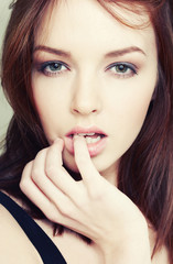 Portrait of sensual young brunette woman.