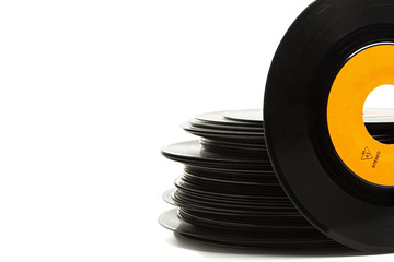 Old single vinyl records stack isolated with copy space