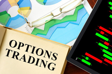 Words options trading written on a book. Business concept.