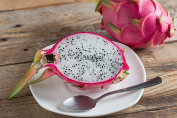 Dragon fruit on white plate.