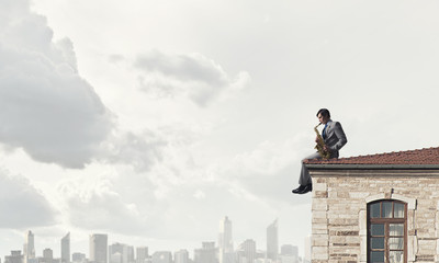 Handsome saxophonist. Concept image