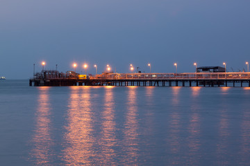 Fototapeta na wymiar Oil pipe to petrol station at seaport twilight time