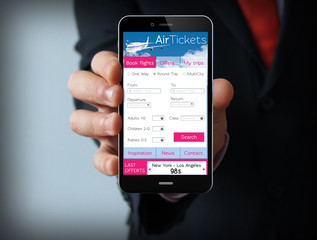 Businessman with ticket flight app on phone