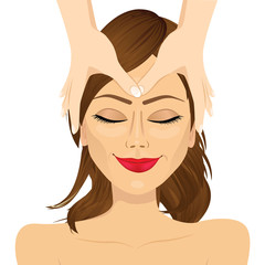 woman enjoying relaxing facial massage treatment