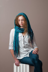 pretty caucasian teenage girl wearing a beautiful blue headscarf