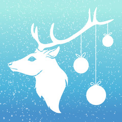Christmas deer with x-mas balls on his horn with snow on blue background