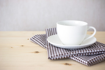 Background with coffee cup on tablecloth