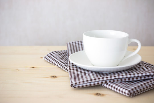 Background with coffee cup on tablecloth