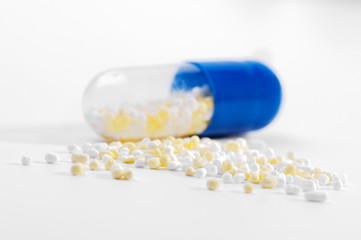 Transparent and blue medicine capsular opened contains granular