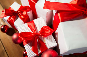 close up of gift boxes and red christmas balls