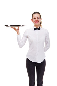 Young woman in waiter uniform holding tray isolated over white