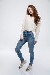 Full length portrait of a happy casual woman