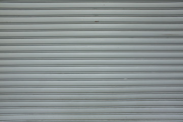 Obraz premium Corrugated metal door Painted surface texture background. Grunge textures backgrounds. Old cracked wall background
