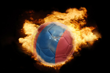 Fototapeta premium football ball with the flag of mongolia on fire