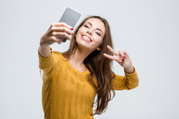 Cute woman making selfie photo