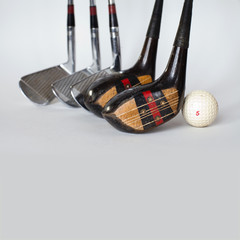 Five vintage, shabby silver, wooden golf clubs