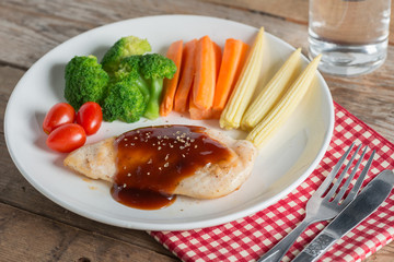 Grilled chicken steak in bbq sauce and vegetable.