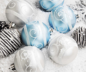 Silver and Blue Christmas Balls in the Snow