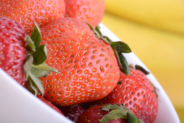 strawberries and bananas close up, health food concept