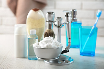 Male luxury shaving kit on shelf, on bricks wall background