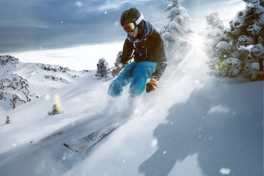 Skier rides through deep powder snow