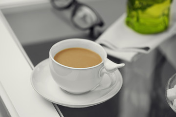 Cup of coffee on table close up