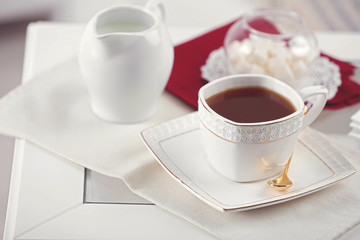 Cup of tea on table in living room