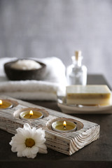 Composition of spa treatment on table colorful background