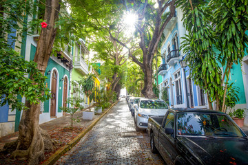 Beautiful street full of trees in old San Juan, Puerto Rico - obrazy, fototapety, plakaty