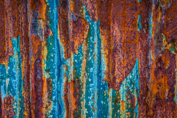 Rusty wall surface with blue paint