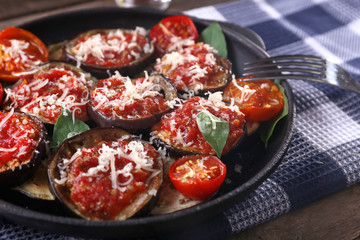 Baked vegetables in pan on table, close-up