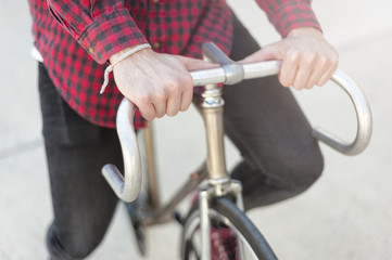 Hipster young boy riding his bike