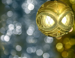 Beautiful Christmas ball on defocused bright colored background