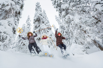 Young adults snowshoeing
