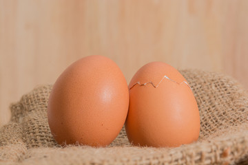 brown eggs with wooden background