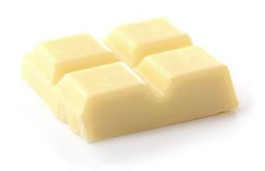 White chocolate pieces isolated on white background