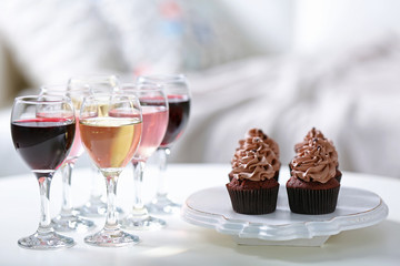Tasting of wine and chocolate cupcakes, close up