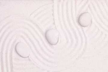 Fotobehang Zen Stenen Zen garden with white marble rocks and wave pattern in the white  © iLight photo