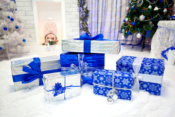 A lot of Christmas presents in a festive interior