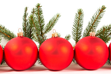 red Christmas balls and fir branch