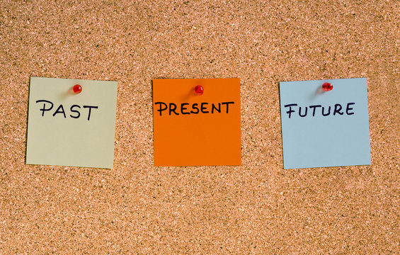 Past, present, future concept. Memo notes pinned on a cork board