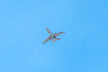 Fototapeta na wymiar Small Airplane Jet in front of blue Sky