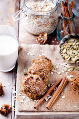 Fototapeta premium Oat and peanut butter cookies with pumpkin seeds,cinnamon,milk.