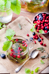 Herbal tea with fresh berries. Romantic autumn, summer background. 