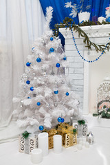 White Christmas tree in a festive interior