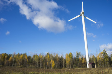 Fototapeta na wymiar windmill for electric power production against blue sky